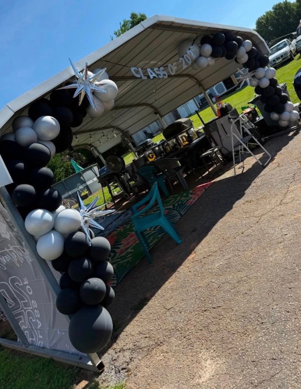 Black and silver graduation balloon arch